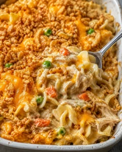 Delicious high-protein creamy chicken noodle casserole with vegetables and cheesy topping