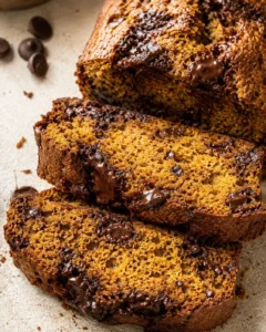 Slices of chocolate-chunk banana bread with a moist crumb and melted chocolate