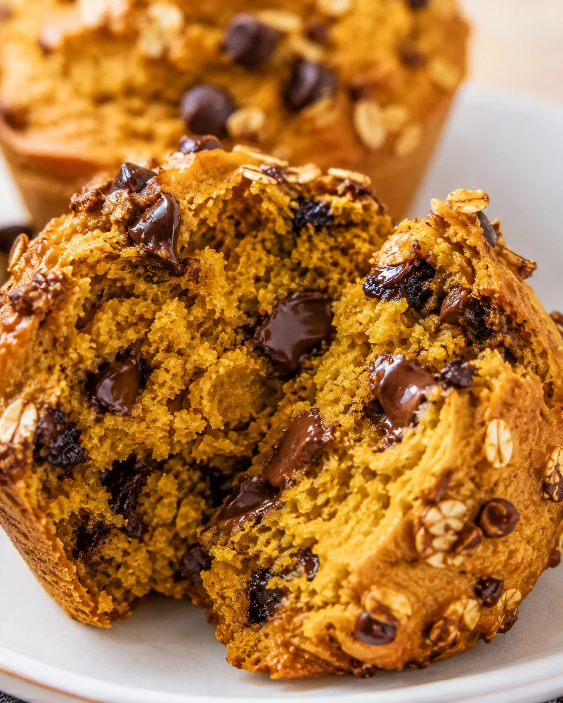 Close-up of moist and fluffy protein pumpkin muffins with chocolate chips